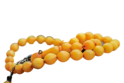 orange beaded necklace with a dark metal clasp laid out on a contrasting background